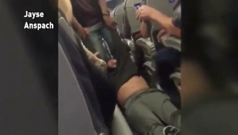 United Airlines Passenger Removed and Arrested from Overbooked Flight 